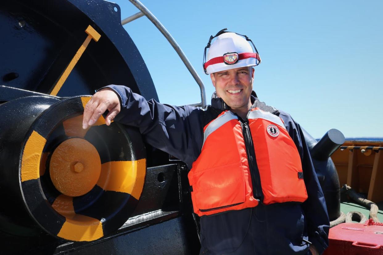 Atlantic Towing port superintendent Alan Roger on the deck of the Spitfire III, one of the newer tugboats in the company's Saint John fleet.   (Julia Wright/CBC - image credit)