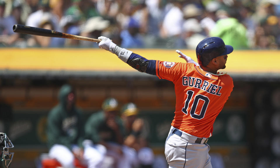 Houston Astros' Yuli Gurriel swings for a three-run home run off Oakland Athletics' Sean Manaea in the third inning of a baseball game Sunday, Aug. 19, 2018, in Oakland, Calif. (AP Photo/Ben Margot)