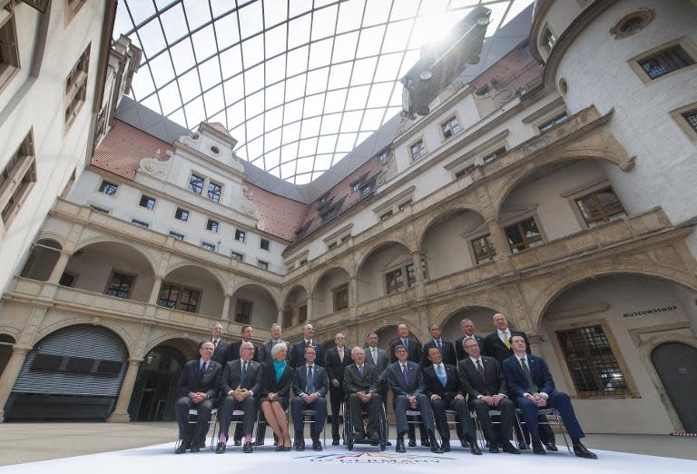 G7 finance ministers and governors pose for a family photo during the G7 summit of Finance ministers at the Palace Residenzschloss in Dresden, Germany, on May 28, 2015