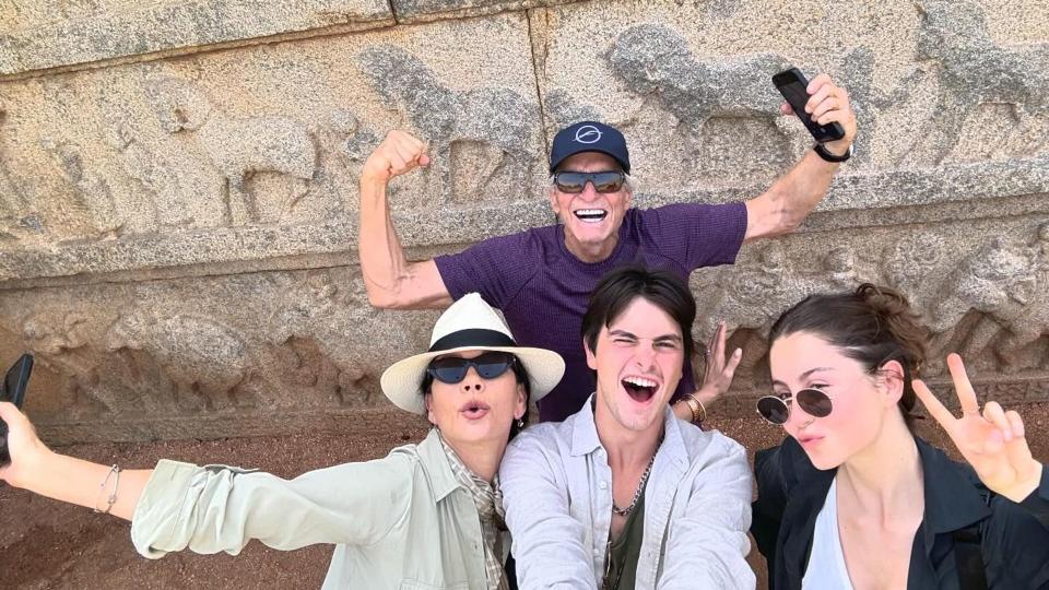 Michael Douglas flexed his muscles as he took a fun photo with his wife Catherine and their two children