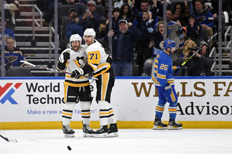 Pittsburgh Penguins right wing Bryan Rust (17) reacts after scoring a goal against the St. Louis Blues in overtime of an NHL hockey game, Saturday, Feb. 25, 2023, in St. Louis. (AP Photo/Jeff Le)