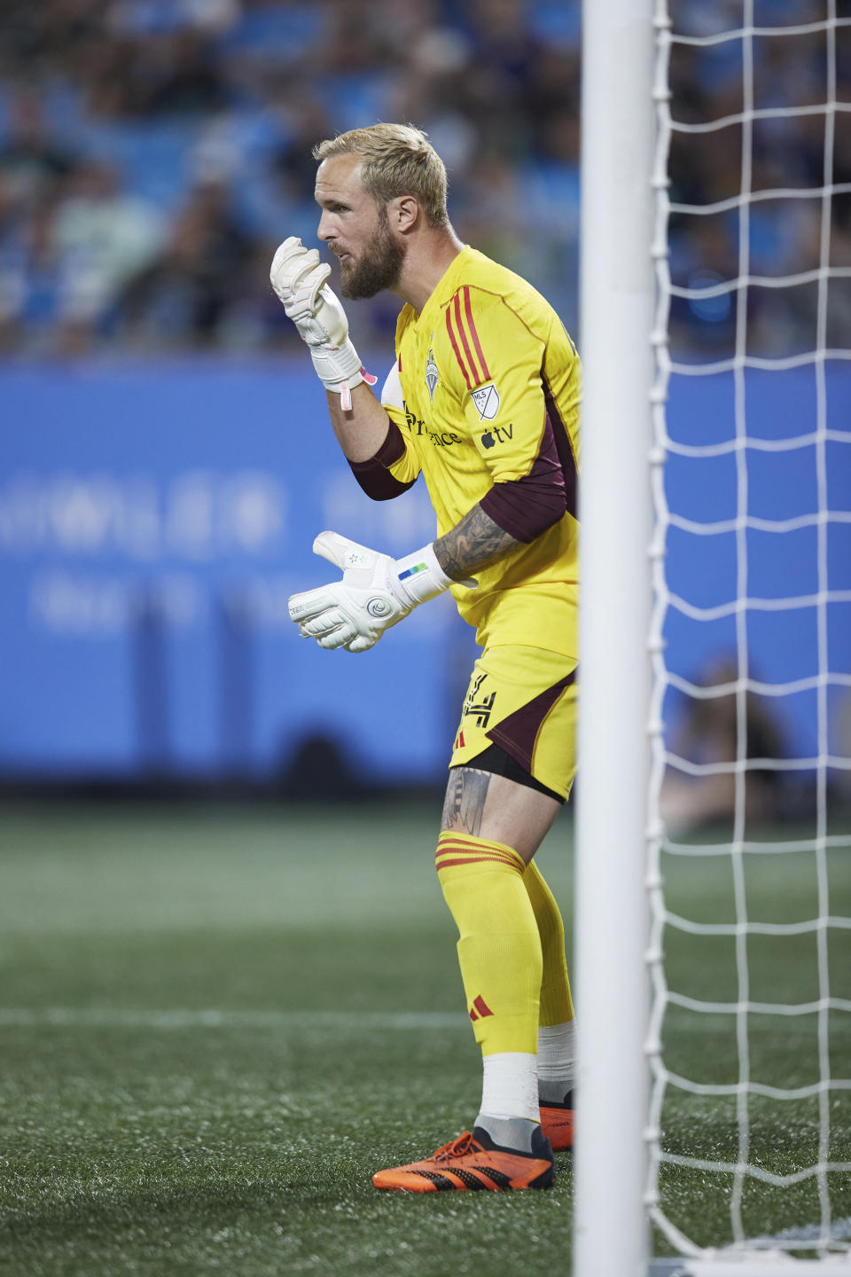 Seattle Sounders goalkeeper Stefan Frei (24) spits on his gloves during an MLS soccer match against the Charlotte FC, Saturday, June 10, 2023, in Charlotte, N.C. (AP Photo/Brian Westerholt)