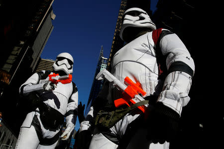 People dressed as Stormtroopers from Star Wars Rogue One walk in Times Square on Christmas Day in Manhattan, New York City, U.S., December 25, 2016. REUTERS/Andrew Kelly/Files