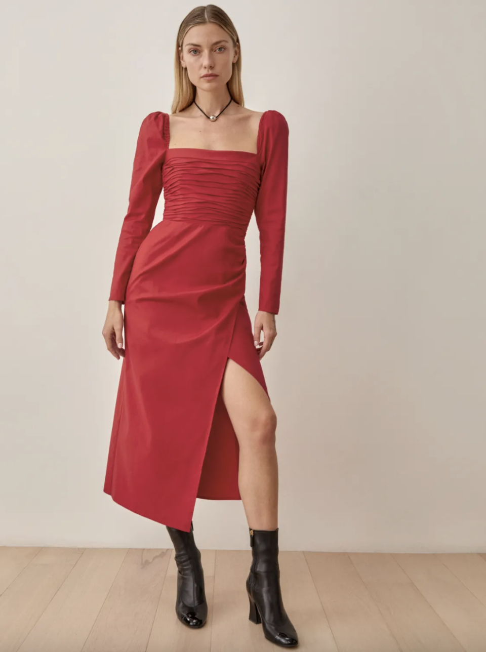 blond model in long sleeve red Reformation Isaac Dress and black leather booties