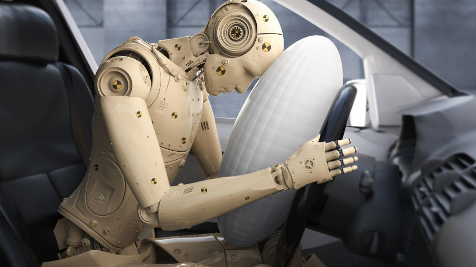 crash test dummy in the front seat of a car, airbag is inflated