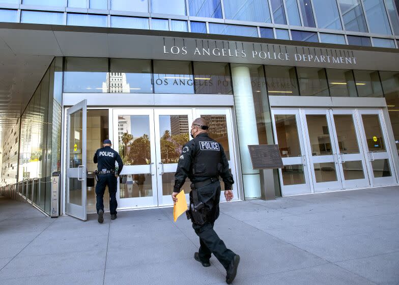 LOS ANGELES, CA - JUNE 03, 2021: Members of the LAPD make their way into LAPD Headquarters on 1st St. in downtown Los Angeles. (Mel Melcon / Los Angeles Times)