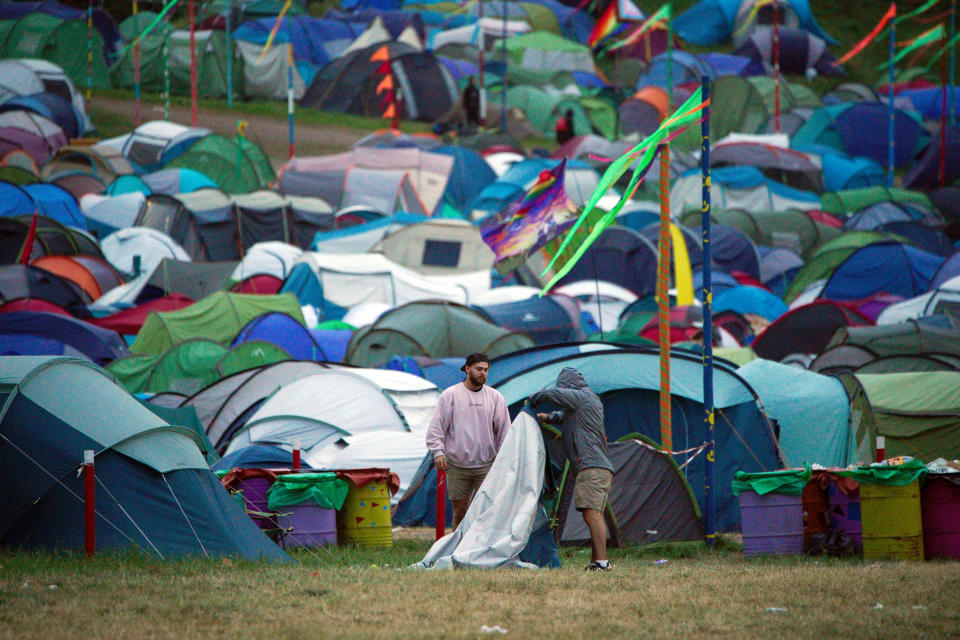 Festival goers pack away a tent at Worthy Farm in Somerset following the Glastonbury Festival. Picture date: Monday June 27, 2022. (Photo by Ben Birchall/PA Images via Getty Images)