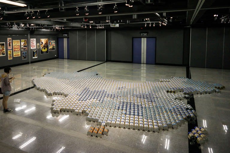 A map of China made from more than 1,800 cans of baby formula created by dissident Chinese artist Ai Weiwei is displayed in Hong Kong on May 17, 2013 reflecting the controversy over mainland demand for milk powder. A surge in demand for formula in China sparked by fears over the safety of domestic milk powder has seen shop shelves around the world cleared out by Chinese buyers