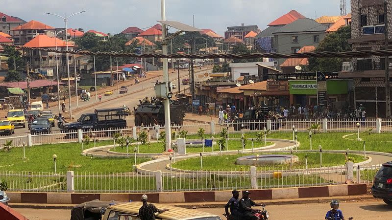 Guinean security forces patrol on the streets after armed men spring Guinea's ex-junta leader Moussa Dadis Camara out of prison in Conakry