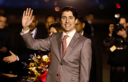 Canadian Prime Minister Justin Trudeau waves towards the media upon his arrival at Air Force Station Palam in New Delhi, India, February 17, 2018. REUTERS/Adnan Abidi