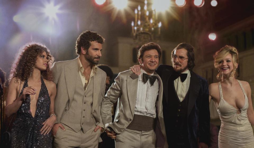 This film image released by Sony Pictures shows, from left, Amy Adams, as Sydney Prosser, Bradley Cooper, as Richie Dimaso , Jeremy Renner, as Mayor Carmine Polito, Christian Bale as Irving Rosenfeld, and Jennifer Lawrence as Rosalyn Rosenfeld, in a scene from "American Hustle." The film was nominated for a Directors Guild award on Tuesday, Jan. 7, 2014. The winners will be announced on Jan. 25. (AP Photo/Sony - Columbia Pictures, Francois Duhamel)