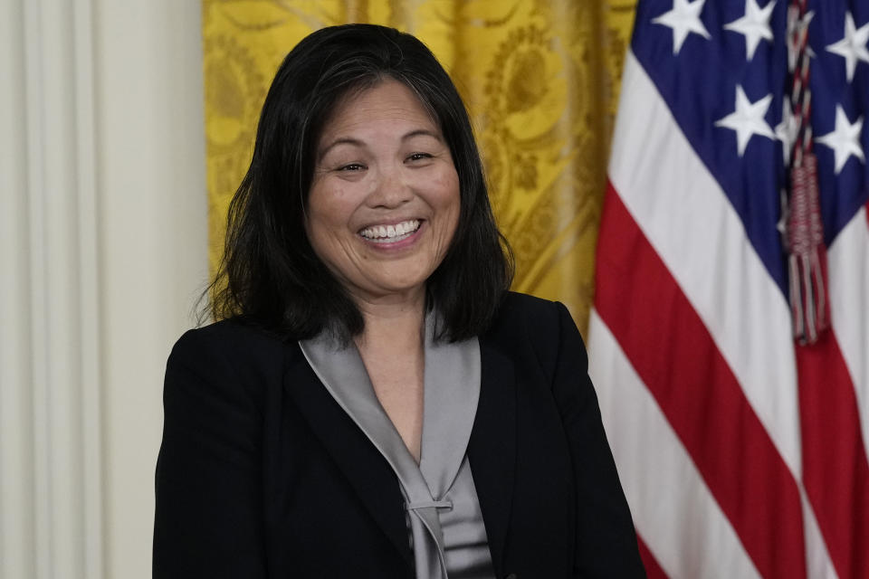 Julie Su, nominated by President Joe Biden to serve as the Secretary of Labor, listens as Biden speaks about her during an event in the East Room of the White House in Washington, Wednesday, March 1, 2023. (AP Photo/Susan Walsh)