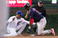 Chicago Cubs second baseman Christopher Morel, left, tags out Boston Red Sox's Franchy Cordero at second base during the second inning of a baseball game in Chicago, Saturday, July 2, 2022. (AP Photo/Nam Y. Huh)