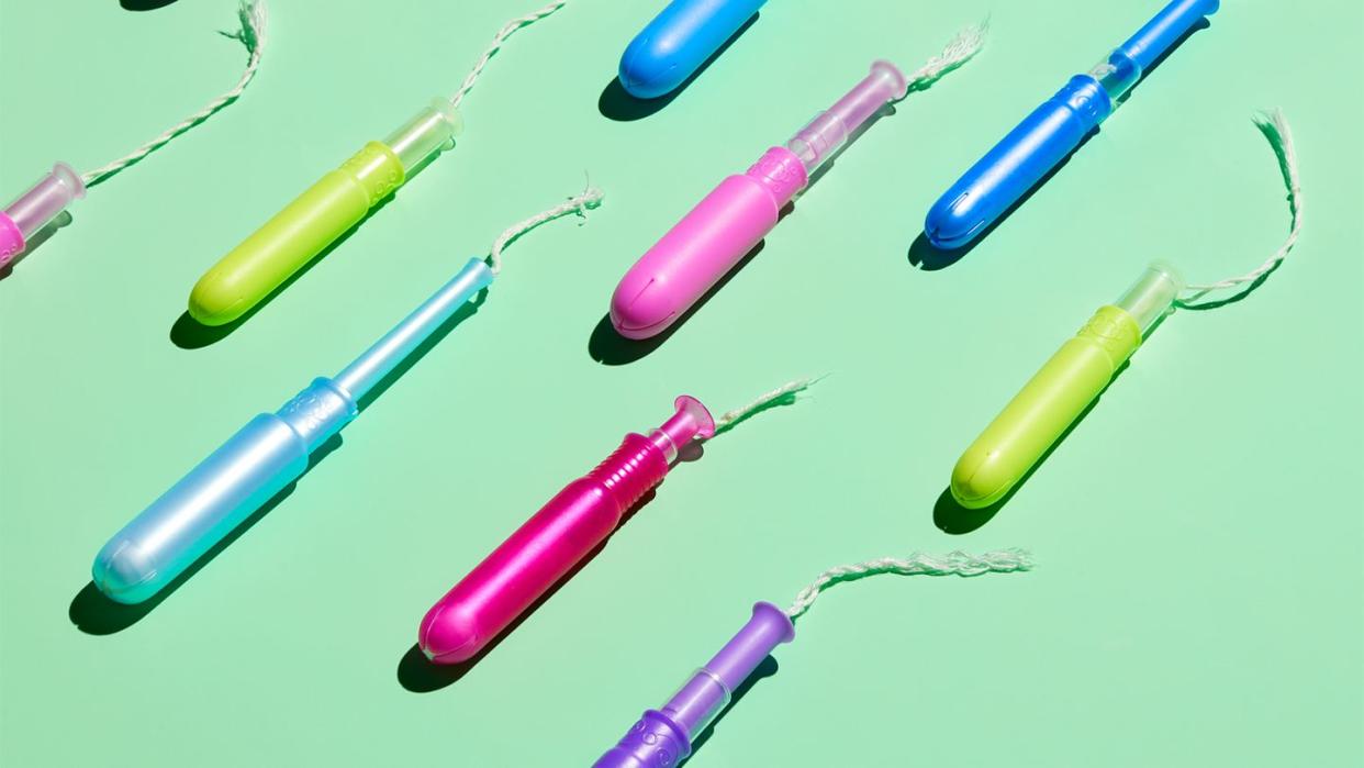 a group of colored tampons