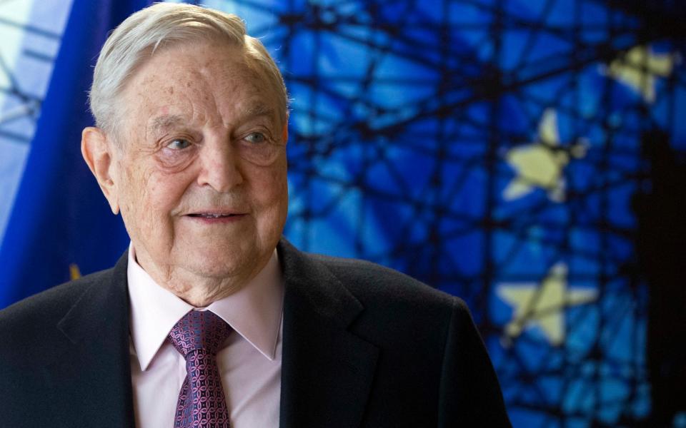 George Soros - Olivier Hoslet, EPA Pool via AP