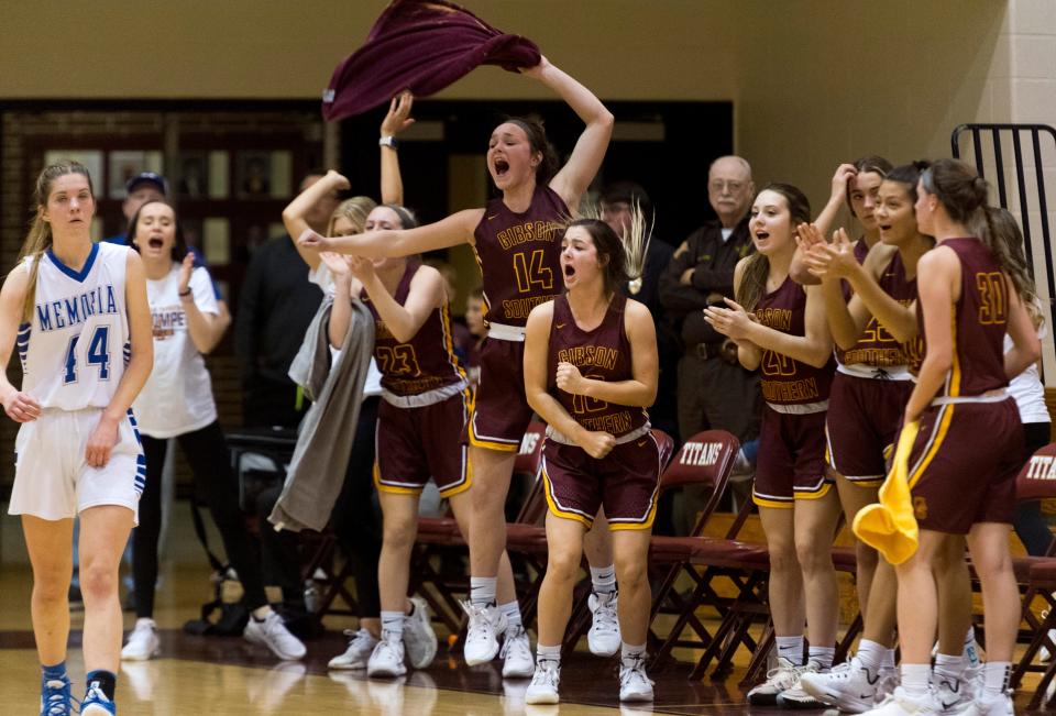 The Gibson Southern bench erupts as the Lady Titans play the Memorial Lady Tigers during the Class 3A girls basketball sectional championship game at Gibson Southern High School Tuesday night, Feb. 8, 2022. 