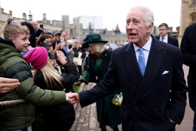 King Charles III and Queen Camilla greet people after attending the Easter Matins Service at St. George's Chapel, Windsor Castle, on March 31, 2024 in Windsor, England - Credit: Hollie Adams - WPA Pool/Getty Images