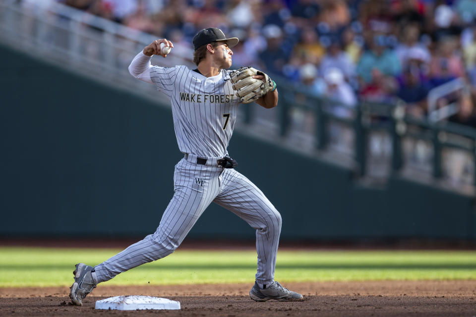 Wake Forest shortstop Marek Houston throws to first for an out against LSU duirng the second inning of a baseball game at the NCAA College World Series in Omaha, Neb., Thursday, June 22, 2023. (AP Photo/John Peterson)