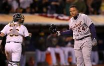 Miguel Cabrera #24 of the Detroit Tigers reacts after striking out in the sixth inning as Derek Norris #36 of the Oakland Athletics walks back to the dugout during Game Three of the American League Division Series at Oakland-Alameda County Coliseum on October 9, 2012 in Oakland, California. (Photo by Ezra Shaw/Getty Images)