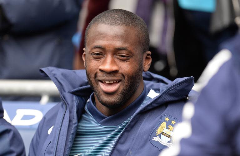 Manchester City's Ivorian midfielder Yaya Toure sits in the dugout ahead of the English Premier League football match between Manchester City and Queens Park Rangers at the Etihad Stadium in Manchester, northwest England, on May 10, 2015