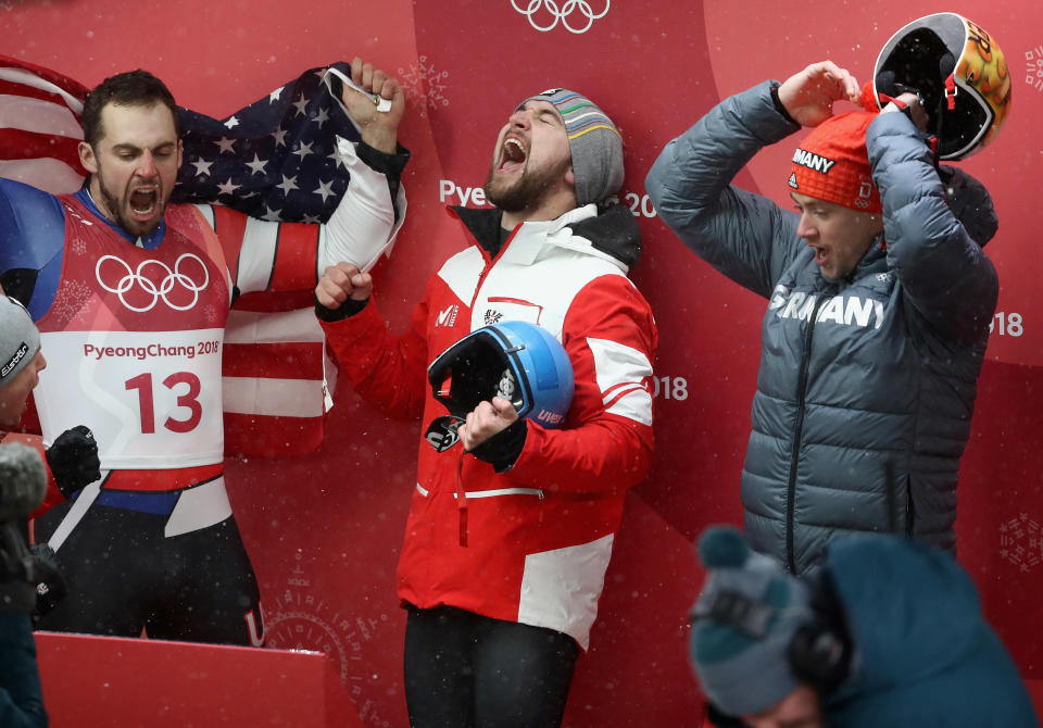 <p>Chris Mazdzer (silver) of the United States, David Gleirscher (gold) of Austria and Johannes Ludwig (bronze) of Germany celebrate following the Luge Men’s Singles. </p>