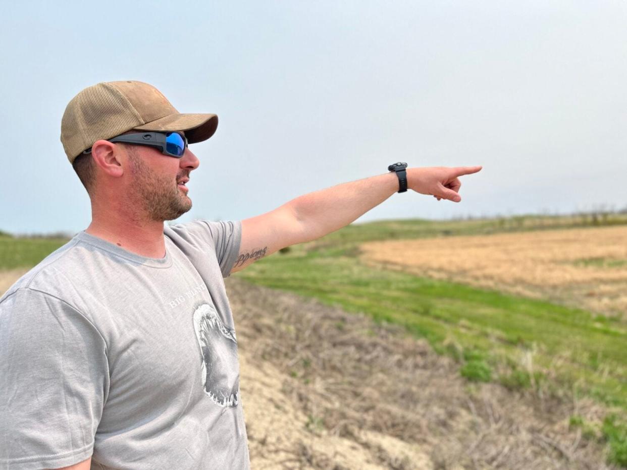 Alex Russo, the owner of a hunting lodge and guiding service in rural Hecla, points to the habitat improvements he and his team have made over the years.