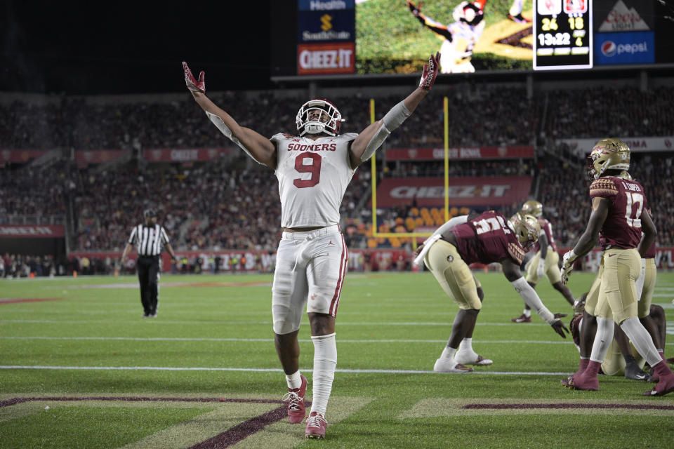 Oklahoma tight end Brayden Willis (9) celebrates after catching a pass in the end zone for a 2-point conversion during the second half against Florida State in the Cheez-It Bowl NCAA college football game Thursday, Dec. 29, 2022, in Orlando, Fla. (AP Photo/Phelan M. Ebenhack)