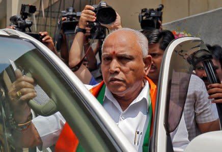 India's ruling Bharatiya Janata Party (BJP) leader and former Chief Minister of the southern state of Karnataka B. S. Yeddyurappa leaves to meet the state governor to stake claim to form the government, in Bengaluru, India, May 16, 2018. REUTERS/Abhishek N. Chinnappa