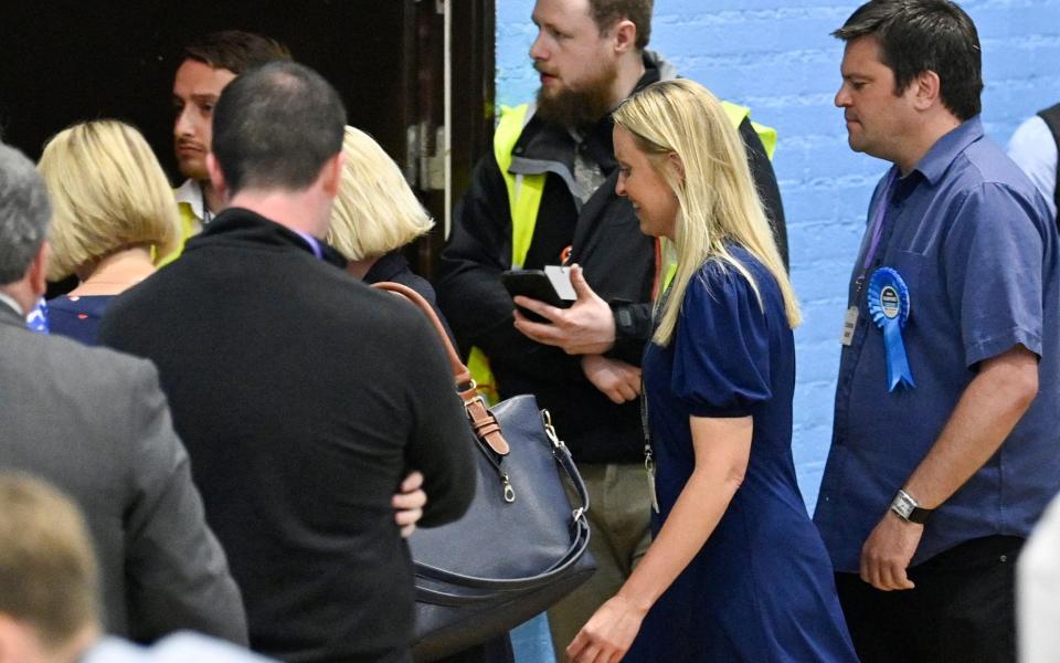 Helen Hurford heads for the exit after her defeat in Tiverton - GETTY IMAGES