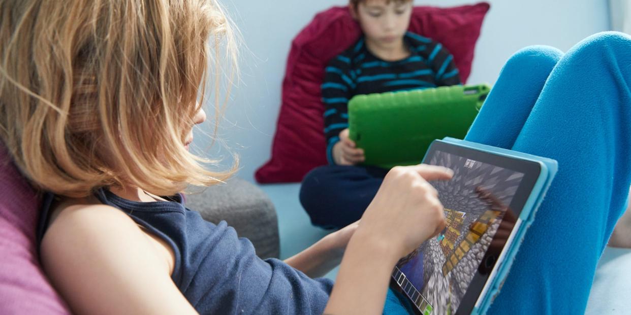 kids playing minecraft on tablets