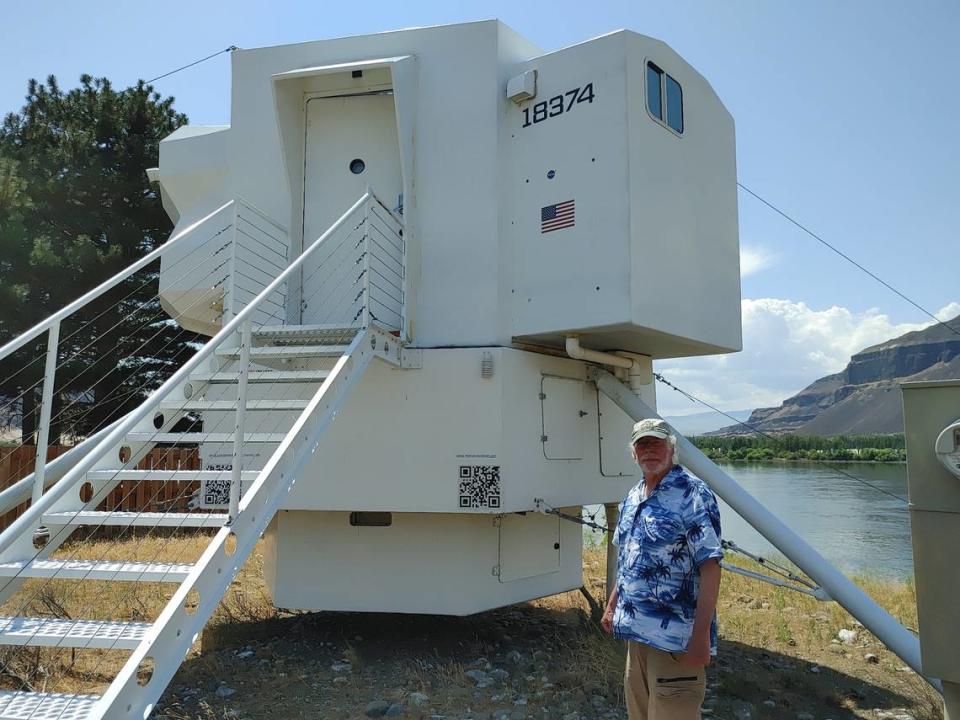 Kurt Hughes, a Seattle naval architect originally from Royal City, poses outside the Lunar Lander Dwelling tiny house he built as a getaway in Beverly, Wash. Wendy Culverwell