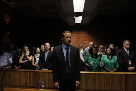 "Blade Runner" Oscar Pistorius awaits the start of court proceedings in the Pretoria Magistrates court February 19, 2013. REUTERS/Siphiwe Sibeko