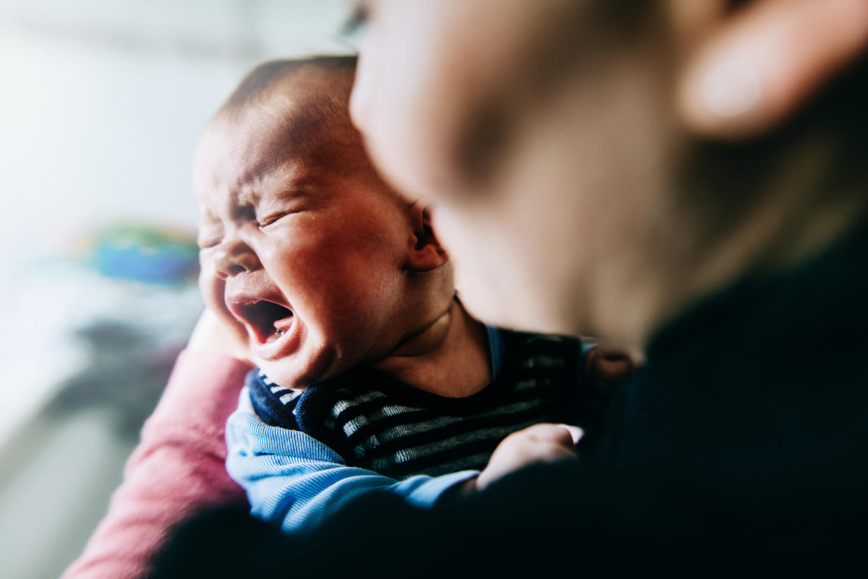 Wondering what to do when your baby cries on an airplane? Yahoo Life asked parents who've been there how they cope. (Photo: Getty Creative)