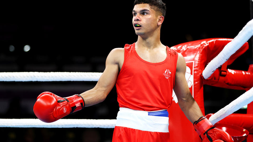 Australia's Alex Winwood looks on in shock after his Commonwealth Games gold medla match was stopped early.