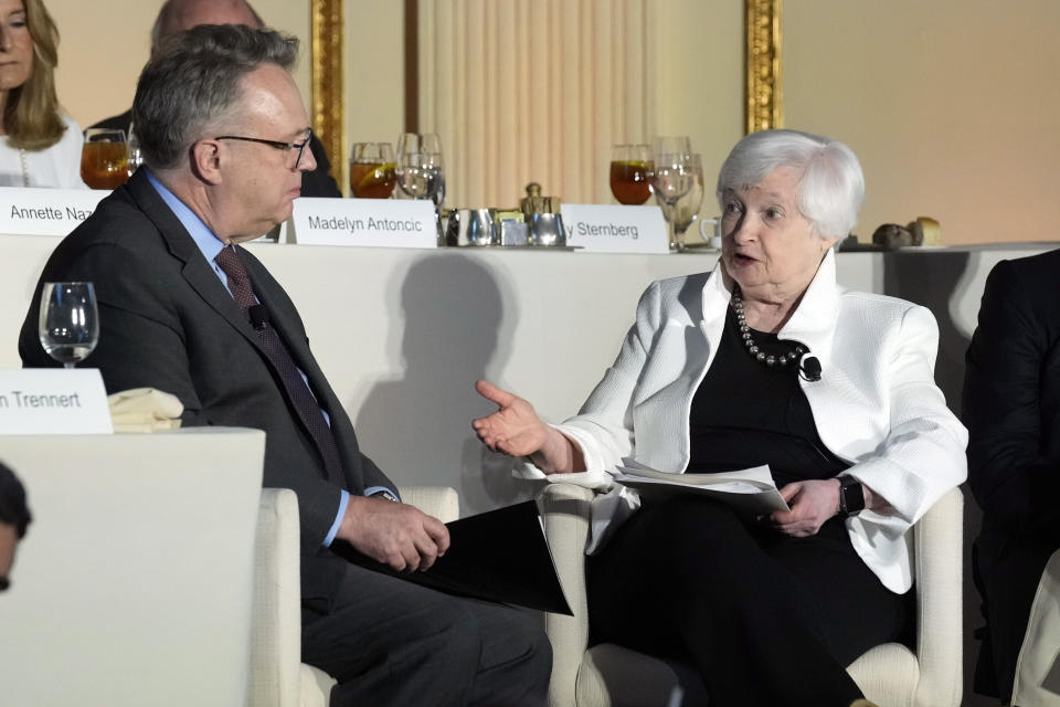 Treasure Secretary Janet Yellen speaks with John Williams, the president and chief executive officer of the Federal Reserve Bank of New York after her address to the Economic Club of New York luncheon, Thursday, June 13, 2024, in New York. Yellen said the U.S. ought to respond "when foreign subsidies threaten the viability of domestic firms" in strategic sectors like green energy. (AP Photo/Richard Drew)