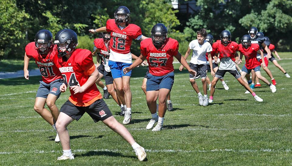 Players go through strength training drills.The North Quincy Raiders football team practice for their first scrimmage on Saturday against S.Mary's of Lynn on Wednesday, August 23, 2023  