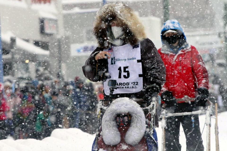 Riley Dyche, a musher from Fairbanks, Alaska, takes his sled dogs through a snowstorm in downtown Anchorage, Alaska, March 5, 2022 (Copyright 2022 The Associated Press. All rights reserved)