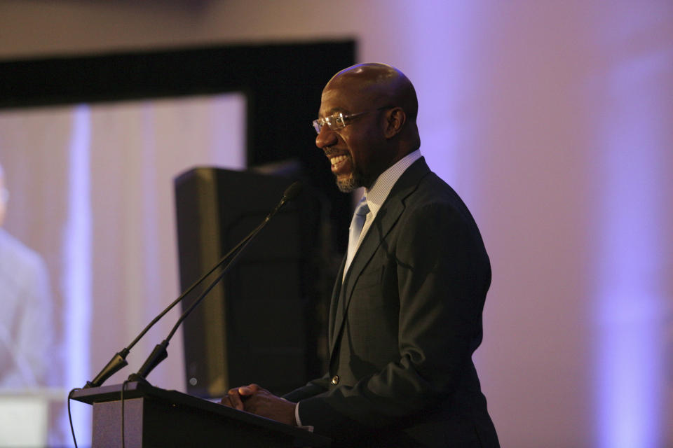 Sen. Raphael Warnock, D-Ga., addresses the Gwinnett County Democratic Party fundraiser on Saturday, May 21, 2022 in Norcross, Ga. (AP Photo/Akili-Casundria Ramsess)