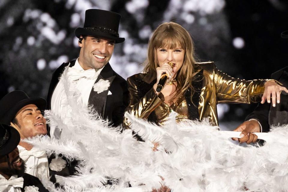 <p>Xavi Torrent/TAS24/Getty Images</p> Jan Ravnik (left) dancing alongside Taylor Swift on May 29, 2024 