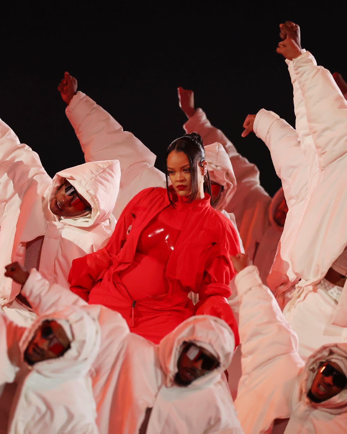 Rihanna wore a poppy-red flightsuit at the Super Bowl (Getty)