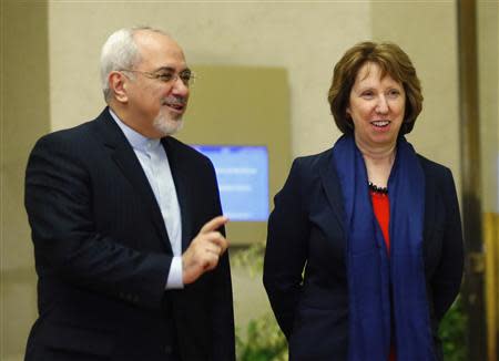 European Union foreign policy chief Catherine Ashton (R) arrives with Iranian Foreign Minister Mohammad Javad Zarif during a photo opportunity before the start of three days of closed-door nuclear talks at the United Nations European headquarters in Geneva November 20, 2013. REUTERS/Denis Balibouse