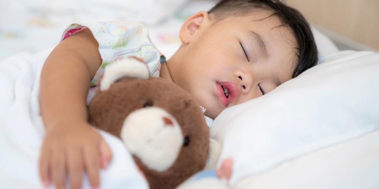 Toddler boy in hospital bed