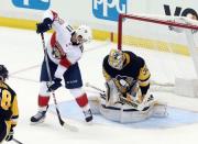 Oct 14, 2017; Pittsburgh, PA, USA; Pittsburgh Penguins goalie Matt Murray (30) makes a save behind Florida Panthers left wing Jonathan Huberdeau (11) during the second period at PPG PAINTS Arena. The Penguins won 4-3. Mandatory Credit: Charles LeClaire-USA TODAY Sports