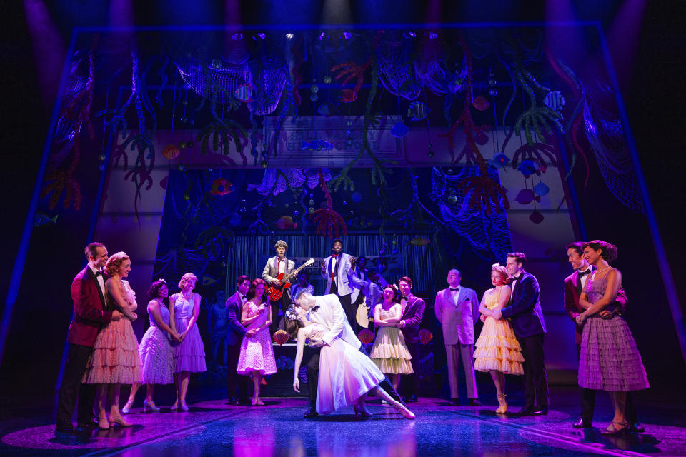 This image released by Polk & Co. shows Casey Likes, and Liana Hunt, center, and the cast during a performance of "Back to the Future: The Musical." (Matthew Murphy and Evan Zimmerman via AP)