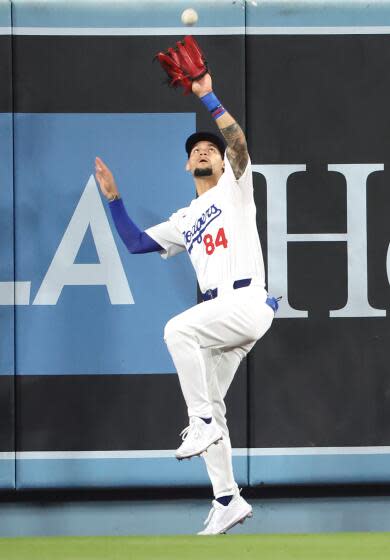 Dodgers center fielder Andy Pages makes a catch at the wall against the Nationals at Dodger Stadium Tuesday.