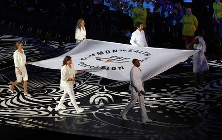 Gold Coast 2018 Commonwealth Games - Opening ceremony - Carrara Stadium - Gold Coast, Australia - April 4, 2018 - CGF flag is carried during the opening ceremony. REUTERS/David Gray