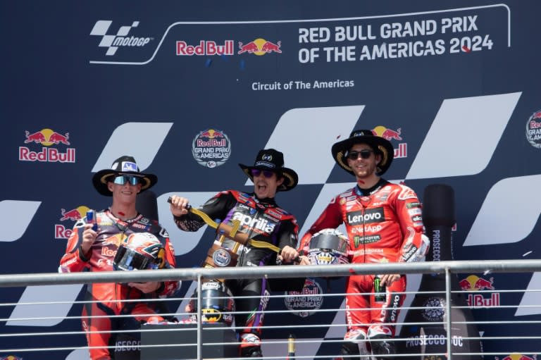 Maverick Vinales of Spain celebrates victory in the MotoGP of the Americas flanked by runner-up Pedro Acosta and third-placed Enea Bastianini (Mirco Lazzari gp)