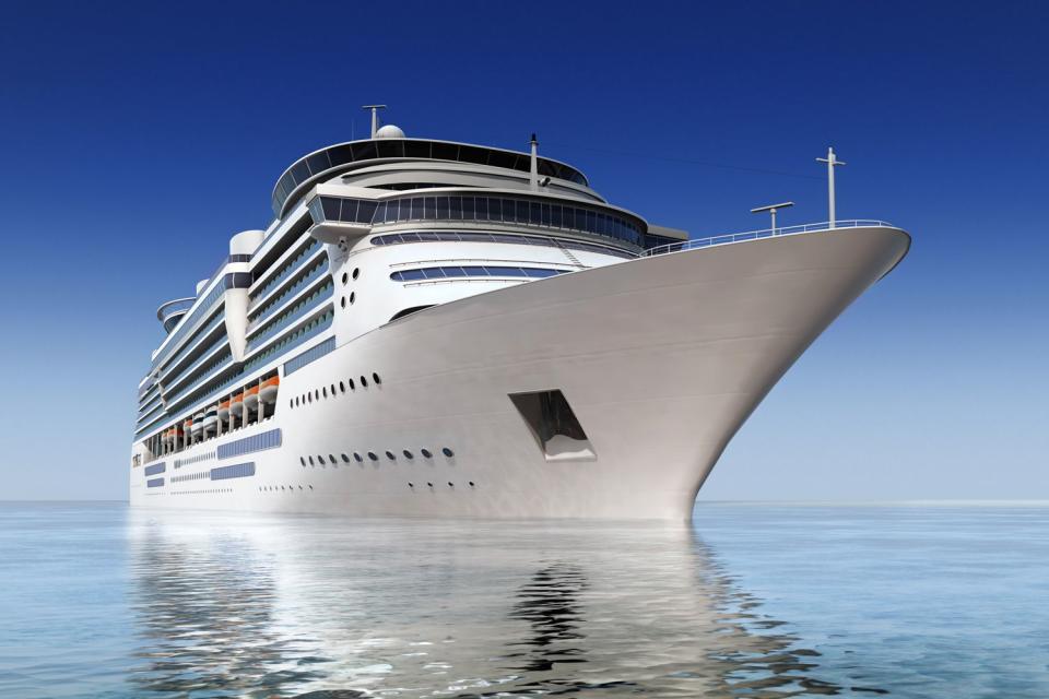 <p>Getty</p> Luxury white cruise ship shot at angle at water level on a clear day