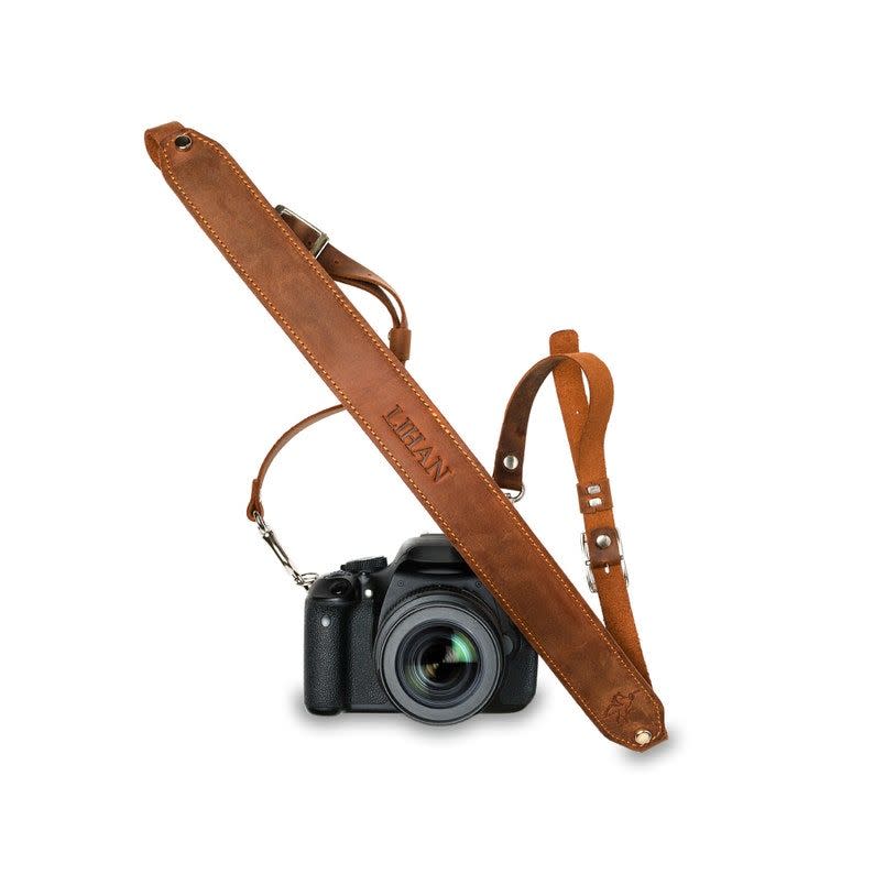 <p><strong>PEGAI</strong></p><p>etsy.com</p><p><strong>$43.20</strong></p><p>A great way to customize your friend's artistic endeavors is with a customized leather strap. This one, set up to accommodate just about any kind of camera, is durable and feels great even after an entire day capturing the moment(s).</p>