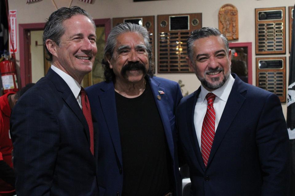 State Sen. Kelly Hancock, R-Fort Worth, (left) and state Sen. Cesar Blanco, D-El Paso, pose for a photo with U.S. Air Force veteran Carlos Rivera following a roundtable discussion with El Paso veterans on Thursday, April 4, 2024.